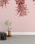 Papier peint nature - ananas roses suspendus fond crème