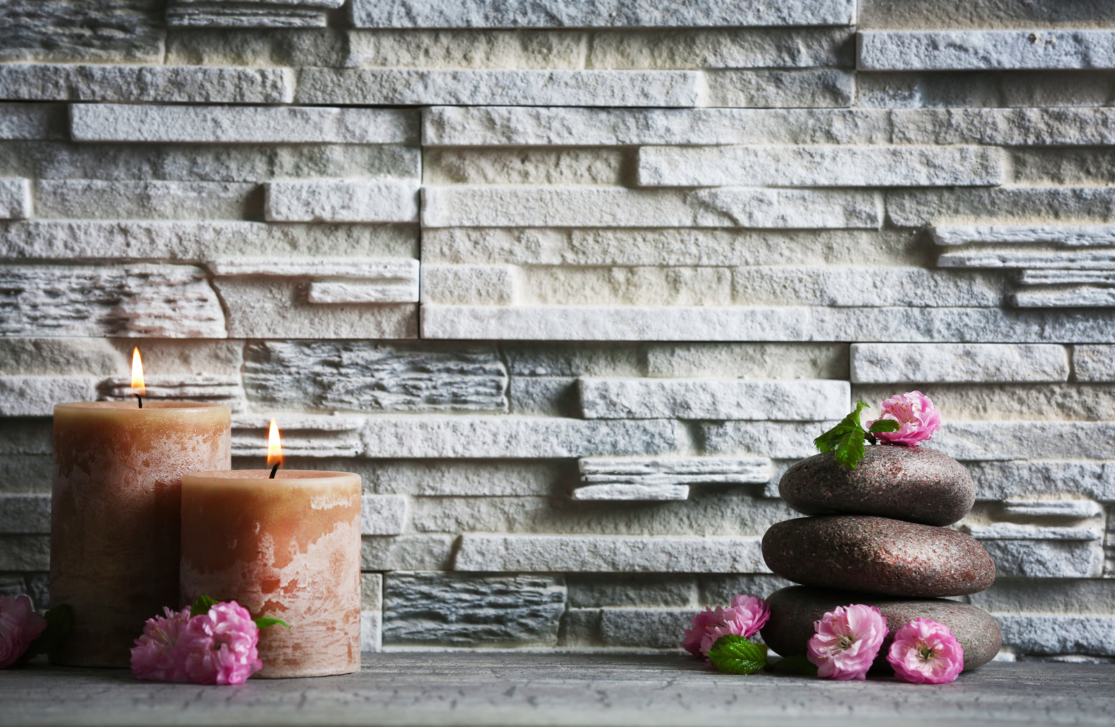 Zen wallpaper – Stacked pebbles and delicate flowers