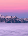 Mountain Wallpaper - Snow-Covered Peak Above the Clouds